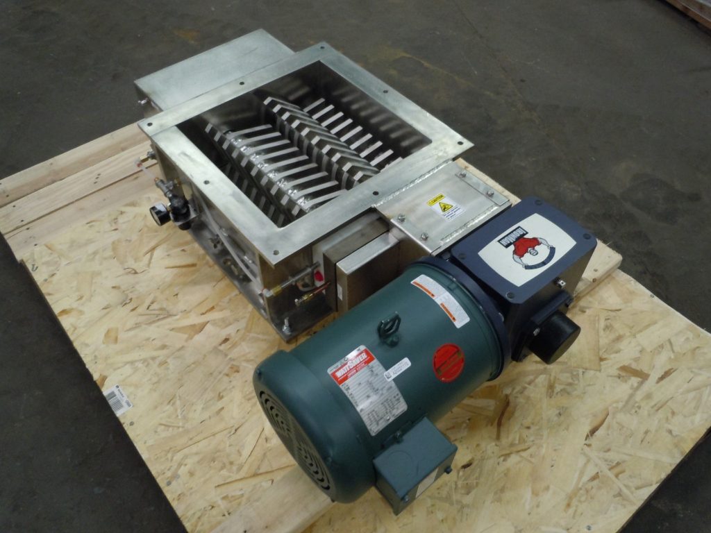 A Model 1515-5HP Motor lump buster on a wooden platform.