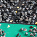 Falling rocks and minerals from a lump breaker.